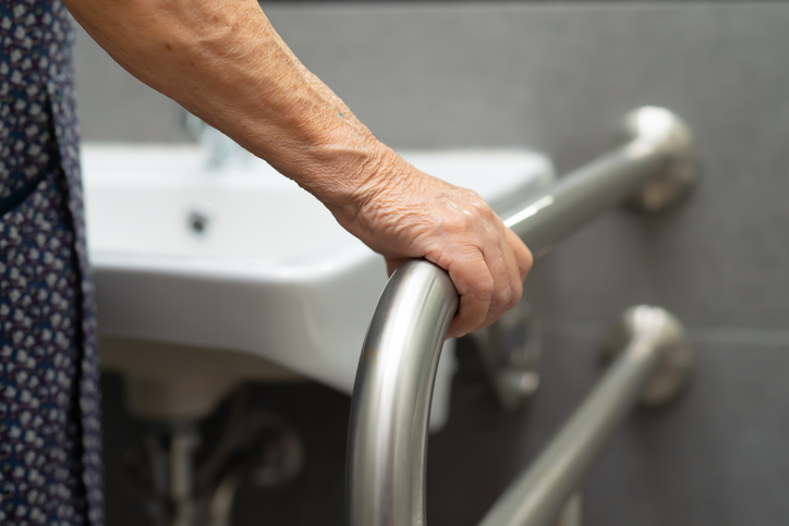 Asian senior or elderly old lady woman patient use toilet bathroom handle security in nursing hospital ward : healthy strong medical concept. accessibility in hospitality industry