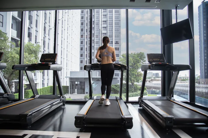 Asian woman exercise in the gym. Healthy and Lifestyle extended stay hotel market